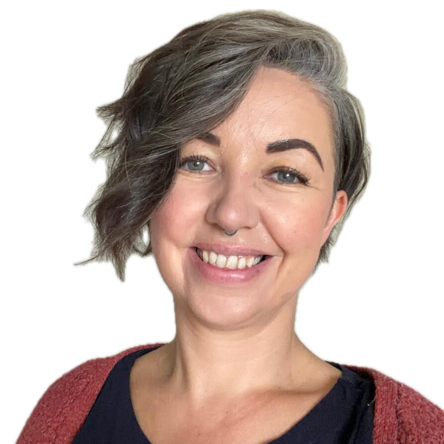 Georgina Biggs Head and shoulders of a counsellor with short hair hair and blue scarf.