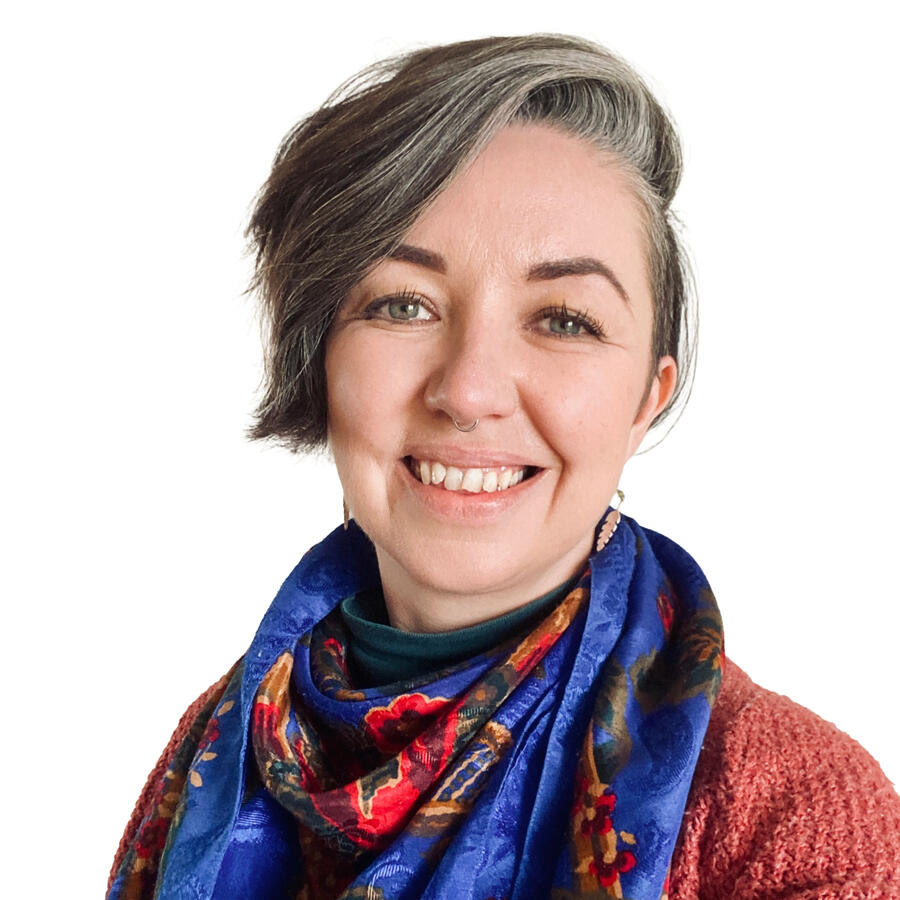 Georgina Biggs Head and shoulders of a counsellor with short hair hair and blue scarf.